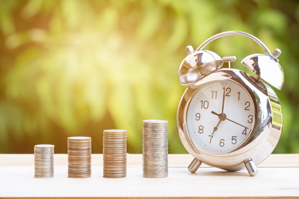 Close up of Time and Money with Green Bokeh Background ,Business