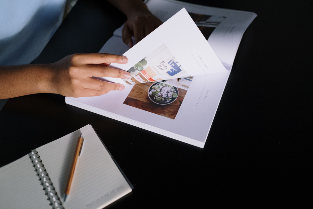 Person Holding White Printer Paper